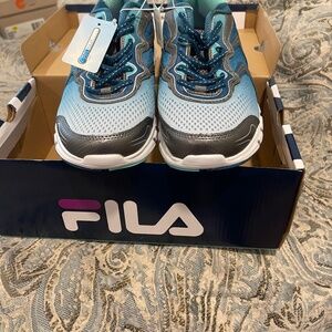 Brand new Fila mesh athletic shoes in size 9.5.  In box and never worn.